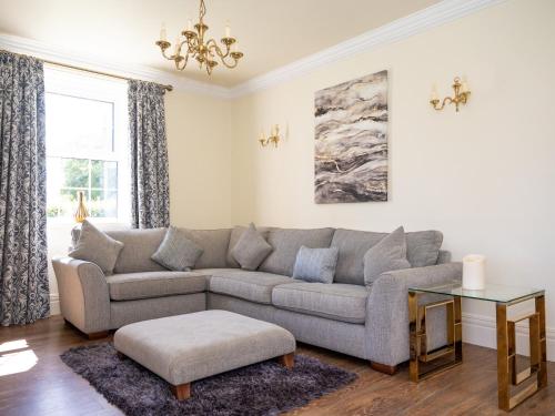 a living room with a couch and a table at The Hind House in Cowlam