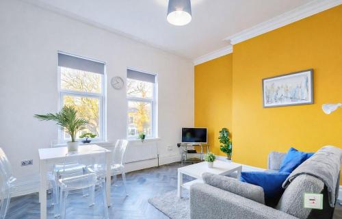 a living room with a couch and a table at The Norton Apartment by GR Estates in Stockton-on-Tees