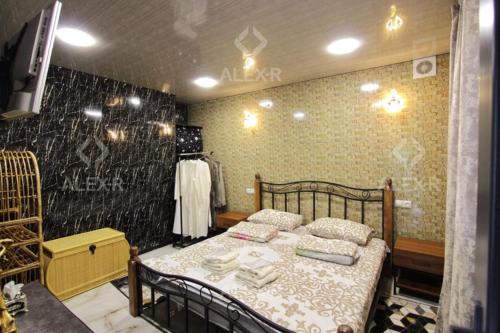 a bedroom with a bed with towels on it at Full Panorama Guest House in Aparan
