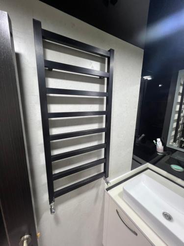a bathroom with a white sink and a mirror at pasanauri gudauri in Passanauri