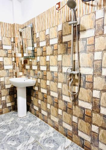 a bathroom with a sink and a shower at Lucky Eagle Nest in Tangalle