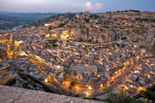 an aerial view of the city of positano at night at Terrazzo sul mare in Donnalucata