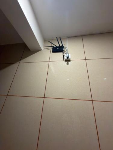 an antenna on the floor of a room at ars inn and mini hall in Tiruvallam