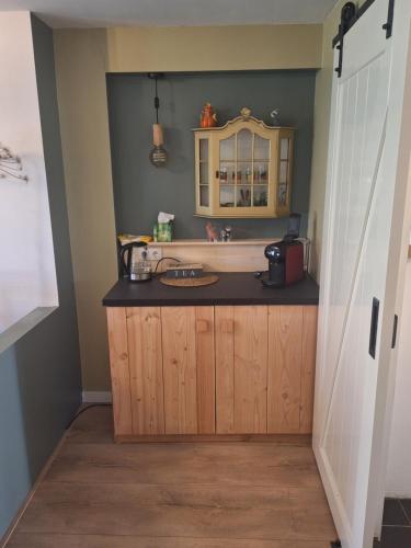 a kitchen with a sink and a counter at Kade10Buren in Buren