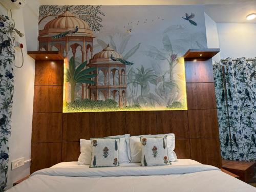 a bedroom with a bed with a painting on the wall at Lila Niwas in Udaipur