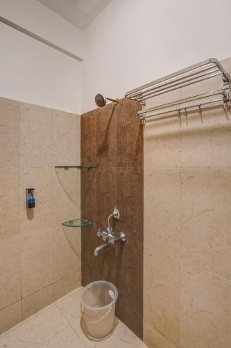a bathroom with a shower with a bucket at Urban Villa ,Baner in Pune