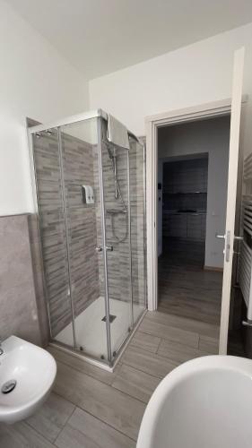 a bathroom with a shower and a toilet and a sink at Fior di Luna in Stresa