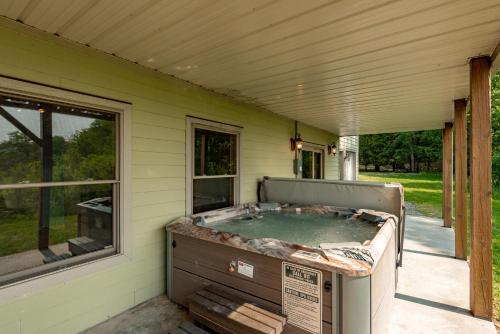 a hot tub in the back of a house at Mountain Paradise by Railey Vacations in Friendsville