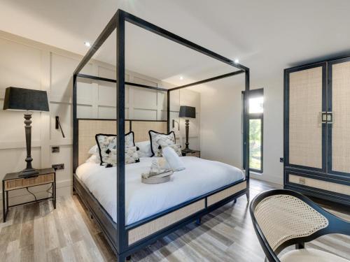 a bedroom with a canopy bed and a chair at 2 Bed in Richmond oc-95005 in Gilling
