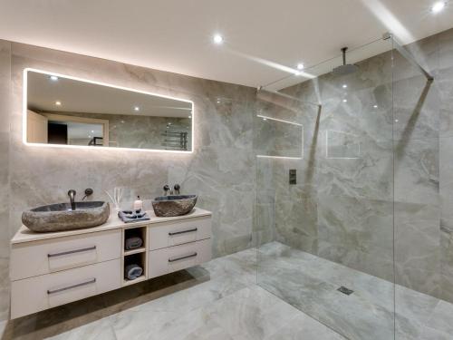 a bathroom with two sinks and a shower at 2 Bed in Richmond oc-95005 in Gilling