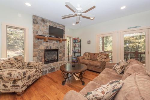 a living room with a couch and a fireplace at Mystic Haven by Railey Vacations in Oakland