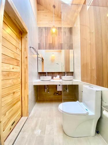 a bathroom with a toilet and a sink at Nordic pool villa huahin6 in HHQ