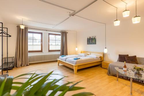 a bedroom with a bed and a table at Landhaus Krell in Mitterretzbach