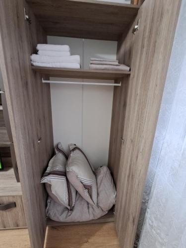 a walk in closet with a bed in it at "NIB's apartment" in Caransebeş