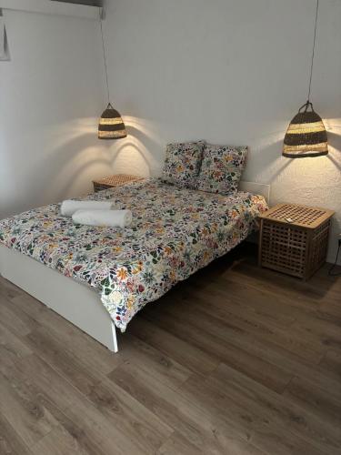 a bedroom with a bed with a comforter and pillows at Charming apartment with stunning mountain views in Levens