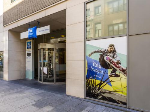 a building with a poster of a man on a skateboard at ibis budget Antwerpen Centraal Station in Antwerp