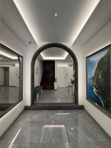 a hallway with an archway in a building at Gold Center Funchal 101 in Funchal