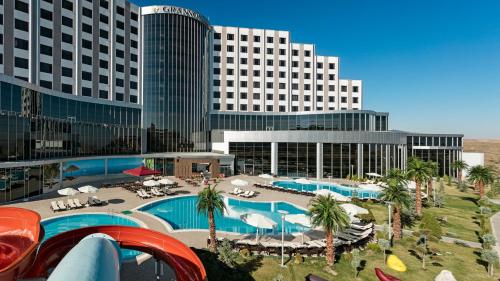 a view of a hotel with a pool and buildings at Grannos Thermal Hotel & Convention Center in Haymana