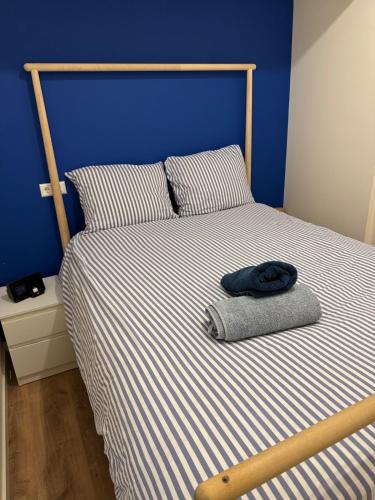 a bed with a pillow and a hat on it at studio at the Rijksmuseum in Amsterdam