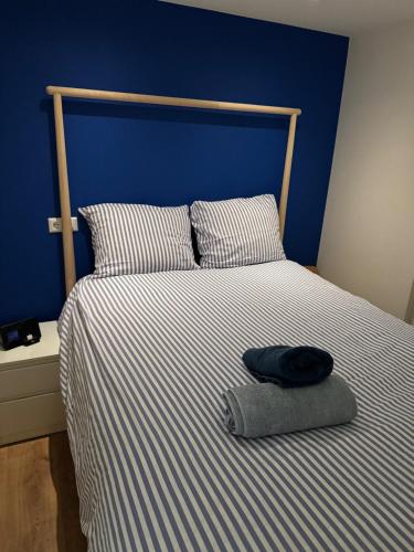 a bed with a pillow and a hat on it at studio at the Rijksmuseum in Amsterdam