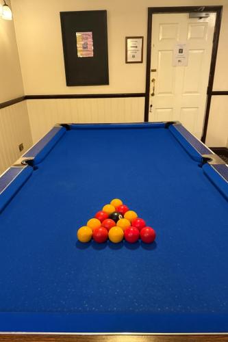 a pool table with a pile of balls on it at Rettendon Lodge in Battlesbridge