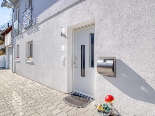 a white building with a door on the side of it at Charme Appartment in Freiburg im Breisgau