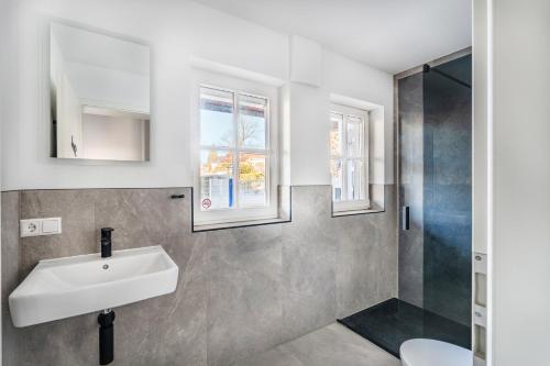 a bathroom with a sink and a shower at Check-In by BeOne RW-N in Rottweil
