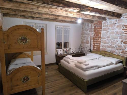Llit o llits en una habitació de La Coccola di Camporovere