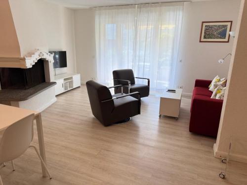 a living room with a couch and a chair at Ascona: ORTO DEGLI ANGIOLI in Ascona