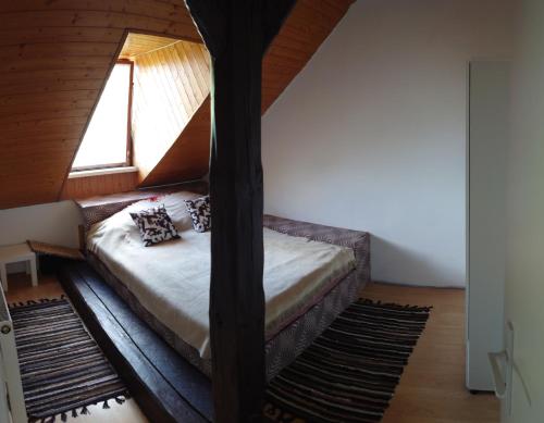 a bed in a room with a window at Zukalka 2KK - 3 in Ostrava