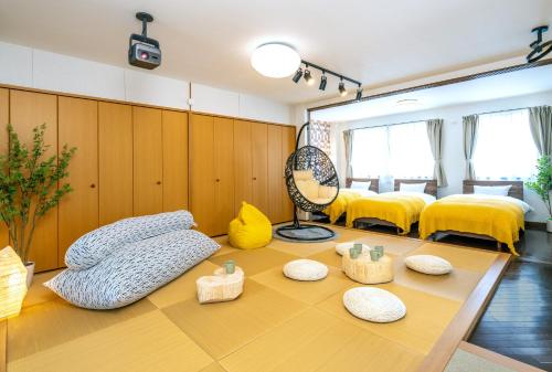 a room with some pillows on a table at Kawaramachi Grande Joy in Takamatsu