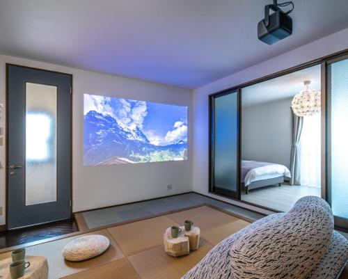 a bedroom with a view of a mountain at Kawaramachi Grande Joy in Takamatsu