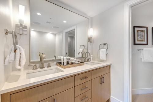 a bathroom with a sink and a large mirror at Abode at Sky Silver in Park City