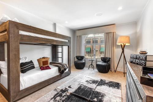 a bedroom with a large bed and a living room at Abode at Sky Silver in Park City