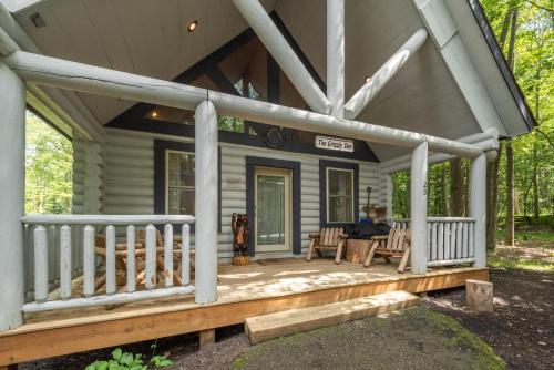 a front porch of a house with a deck at The Grizzly Den by Railey Vacations in Oakland