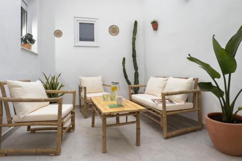 a room with chairs and a table and a table and chairs at Casa La Pedrera in Pedralba