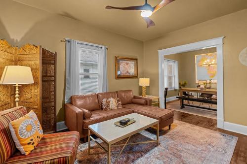 a living room with a couch and a table at Cairo St Bungalow in Springfield