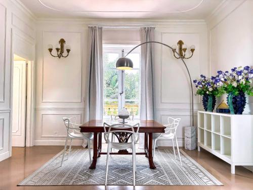 a dining room with a table and chairs at VILLA MARRONE - Relais - in Marsala