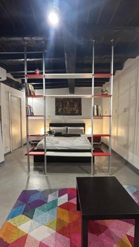 a bedroom with a bunk bed and a colorful rug at Casa in Piazzetta in Zagarolo