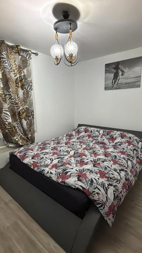 a bed in a bedroom with avertisementatronatronstrationstrationstration at Maison a côté de Disney in Chessy