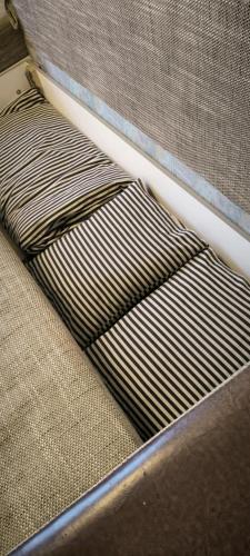a close up of a bed with at Masčio apartamentai in Telšiai
