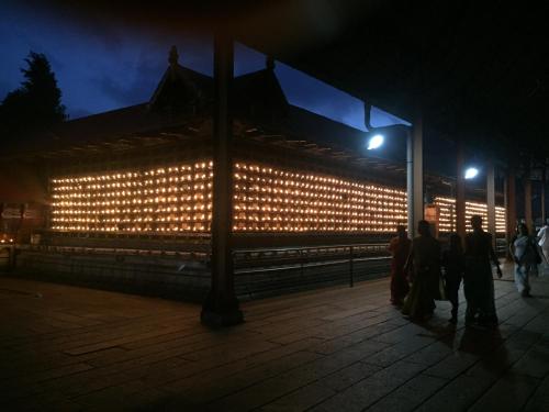 a building with lights on it at night at Ayana's Homestay in Alleppey