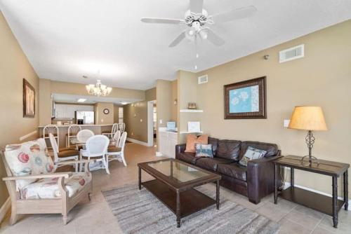 a living room with a couch and a table at Jade East Towers 0740 in Destin