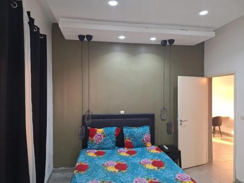 เตียงในห้องที่ Astou Prestige