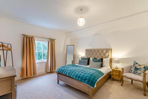 a bedroom with a bed and a chair at 2 Bed in Southwell oc-n30605 in Southwell