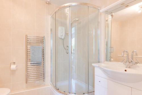 a bathroom with a shower and a sink at 3 Bed in Putsborough oc-flat11 in Croyde