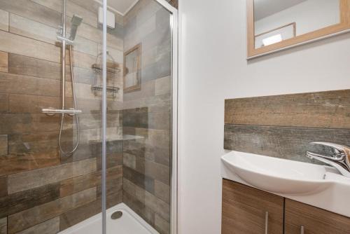 a bathroom with a sink and a shower at 4 Bed in Ffestiniog oc-bow172 in Ffestiniog