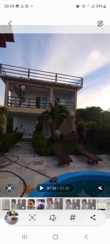 a screenshot of a house with a picture of a pool at Casa da Lelê in Acaraú