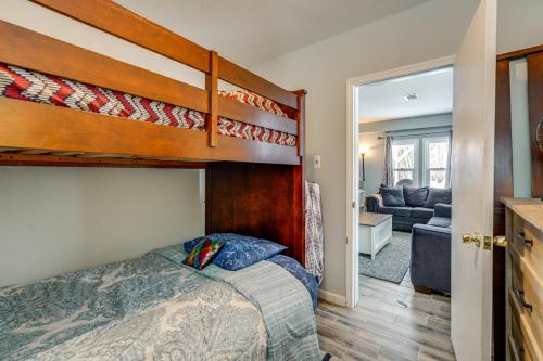 a bedroom with a bunk bed and a living room at Woodsy & Charming! Applegate Cabin w/ Large Yard in Applegate