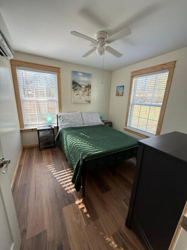 a bedroom with a bed and a flat screen tv at 2 Bedroom home near Mammoth Cave NP in Mammoth Cave